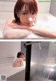 A woman taking a bath in a bathtub with foam.